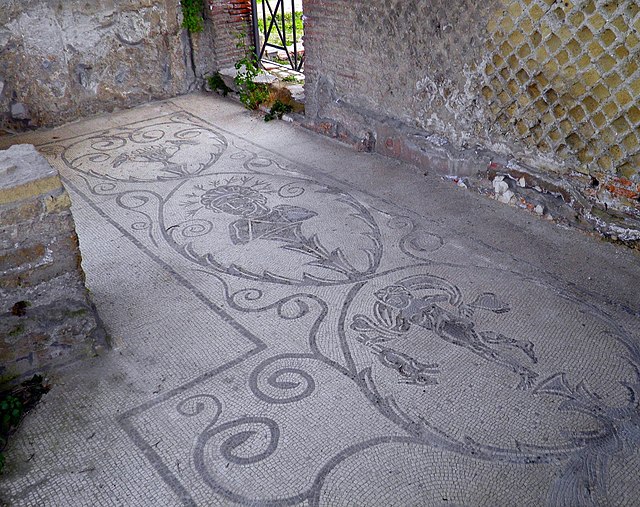 Questa immagine ha l'attributo alt vuoto; il nome del file è storia-romana-640px-Mosaic_tile_floor_from_the_Baths_of_Venus_Child_with_Hare_and_probably_the_Emperor_Hadrian_Archaeological_park_of_Baiae_Baia_12137573166.jpg